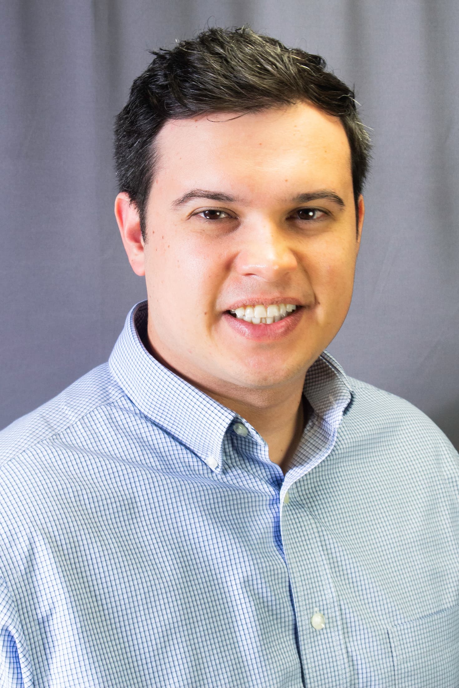 Headshot of Reis Cantrill 