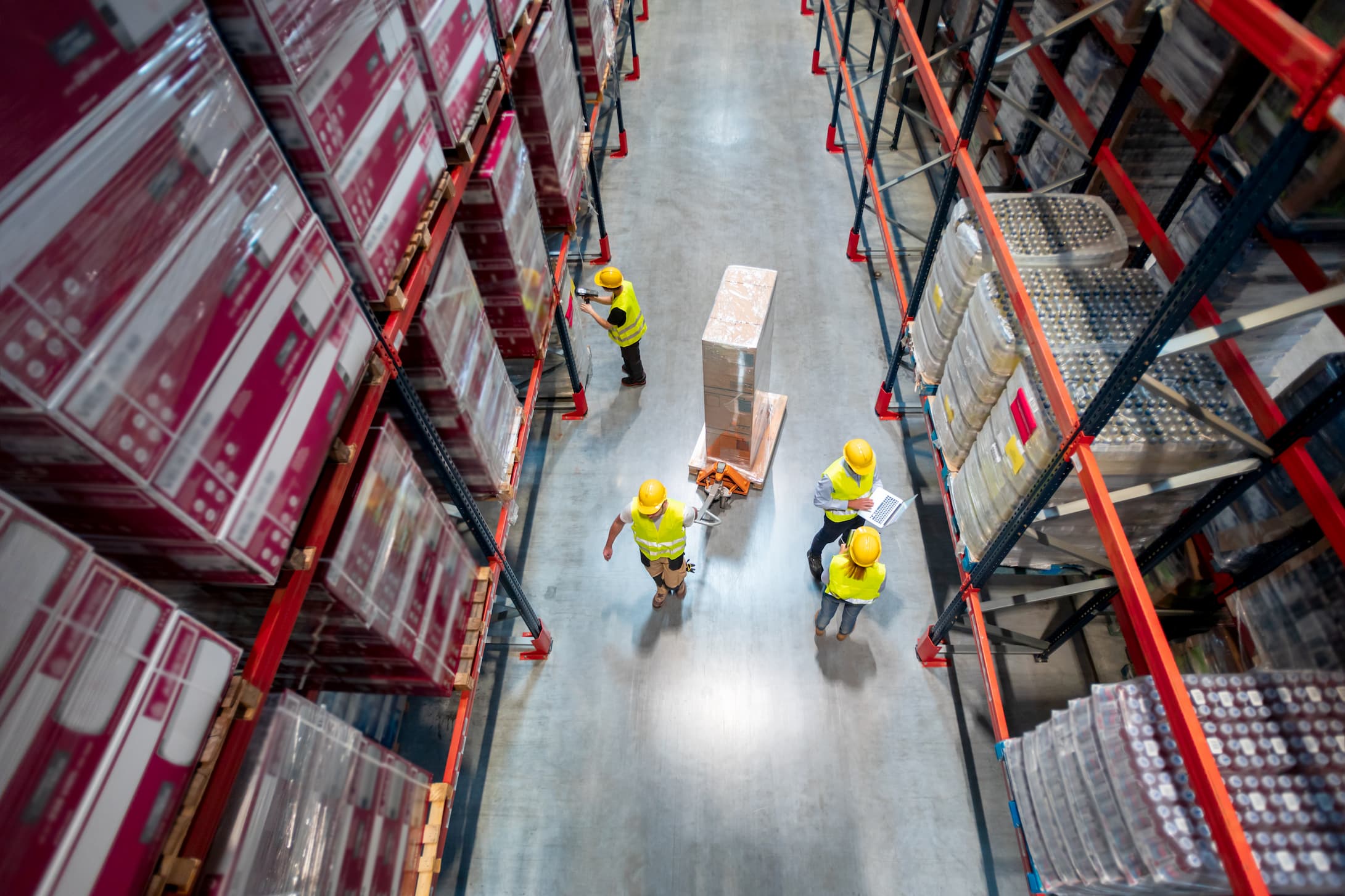 an aerial view of workers inside a warehouse